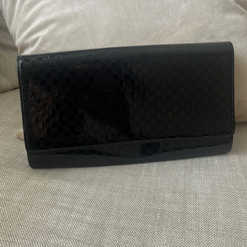 Patent leather clutch bag
Never worn
Black, Patent leather